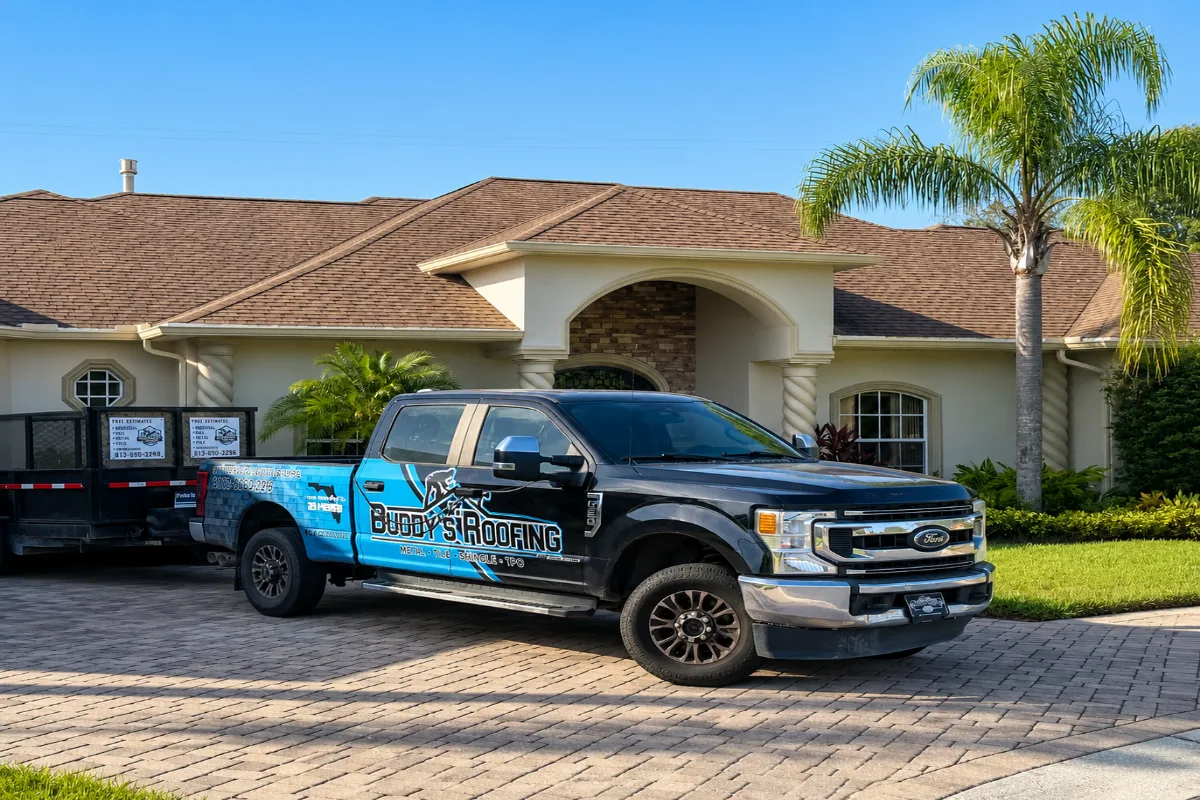 A navy service van arriving outside a well-kept suburban home, a roofer stepping out with a tool bag